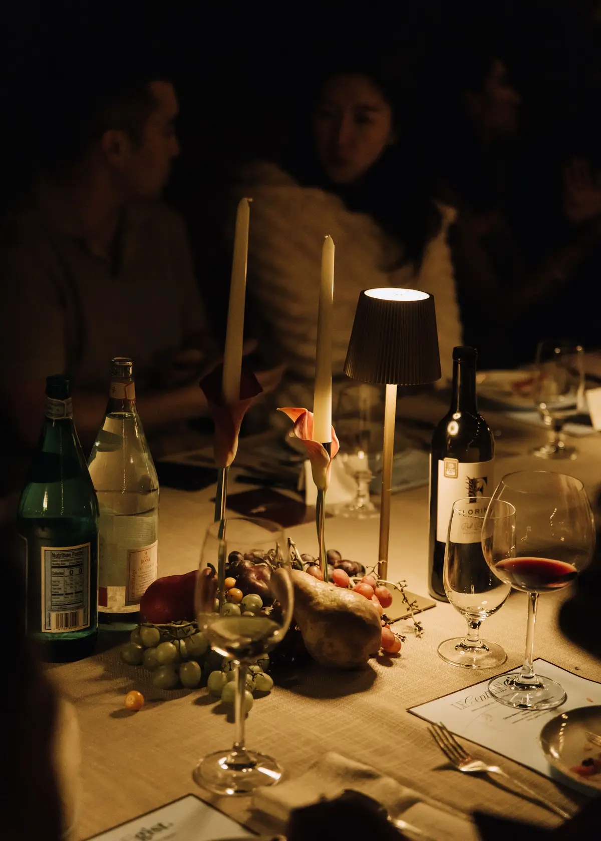 Candles and wine on the table at night