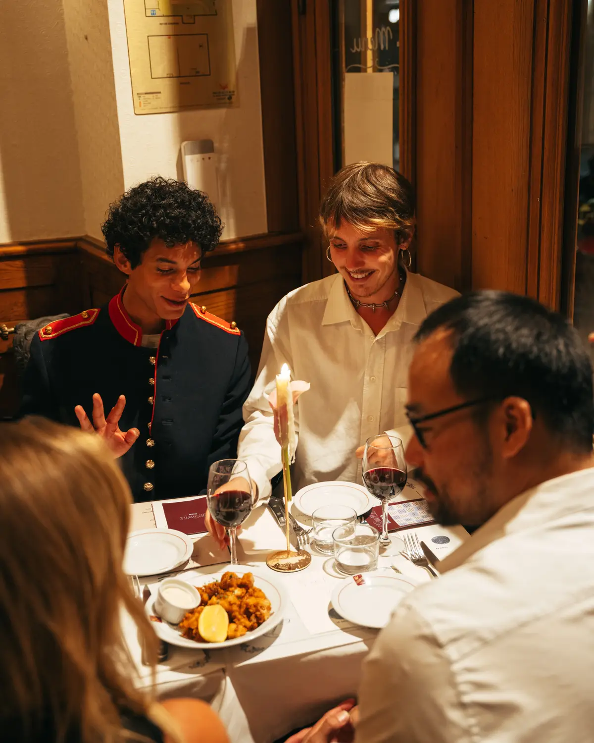 Guests talking over dinner